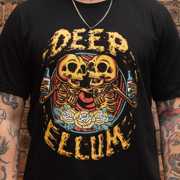 T-shirt with graphic image of two skeletons bro-hugging and raising their bottles in toast to friendship