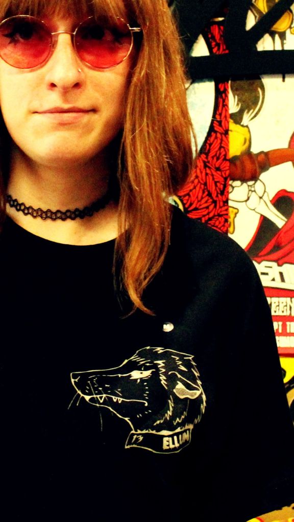 Woman in black Punk Possum Tee Shirt